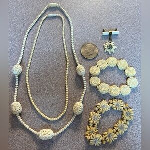 Collection of faux ivory jewelry.